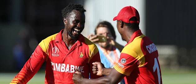 Brian Vitori (L) of Zimbabwe celebrates taking the last wicket of Shahpur Zadran of Afghanistan during the ICC Cricket World Cup Qualifier between Zimbabwe and Afghanistan at Queens Sports Club on March 6, 2018 in Bulawayo, Zimbabwe (©ICC).
