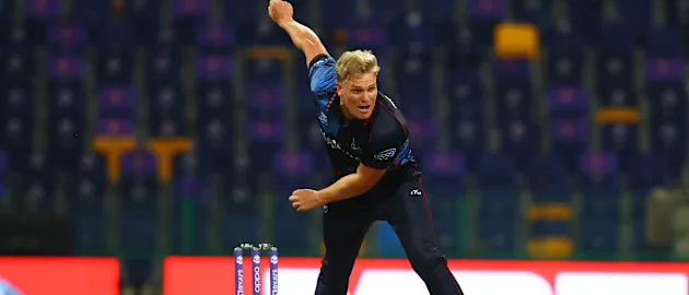 Ruben Trumpelmann of Namibia in bowling action during the ICC Men's T20 World Cup match between Scotland and Namibia at Sheikh Zayed stadium on October 27, 2021 in Abu Dhabi, United Arab Emirates.