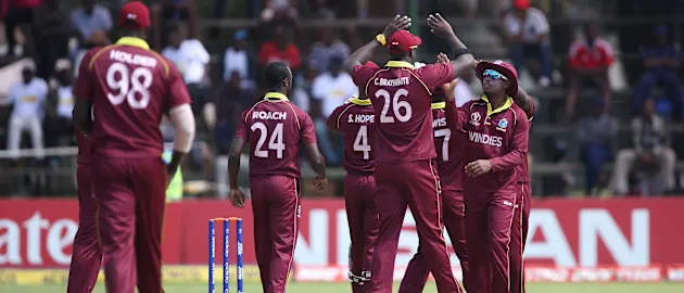 Windies players celebrate the wicket of Michael Jones of Scotland during The ICC Cricket World Cup Qualifier between The Windies and Scotland at The Harare Sports Club on March 21, 2018 in Harare, Zimbabwe (©ICC).