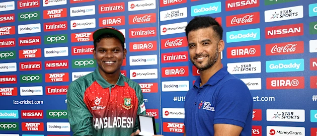 Rakibul Hasan of Bangladesh the player of the match award from JP Duminy during the ICC U19 Cricket World Super League Cup Quarter Final 3 match between Bangladesh and South Africa at JB Marks Oval on January 30, 2020 in Potchefstroom, South Africa.