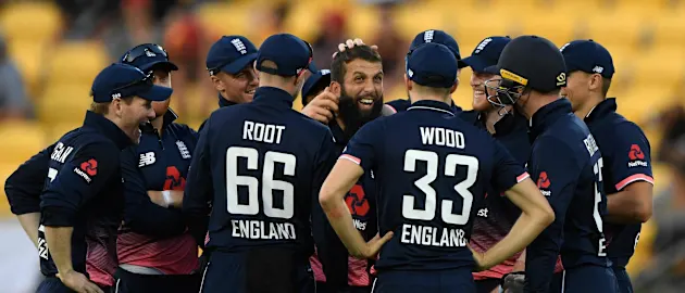 Moeen Ali celebrates with his teammates