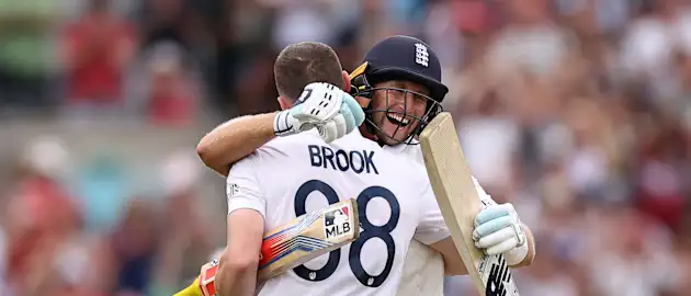 Harry Brook and Joe Root celebrate
