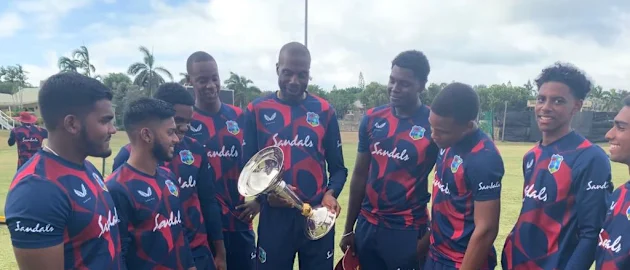 Curtly Ambrose holds U19 Men's CWC Trophy