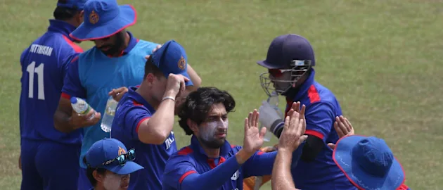 Mahsid Faheem celebrates with his teammates