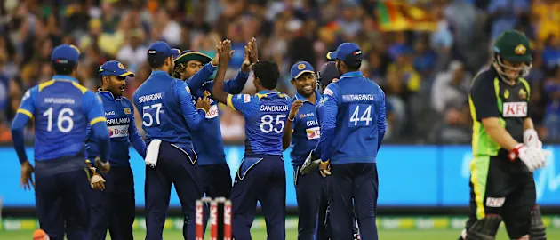 Sri Lankan players celebrate the wicket of Michael Klinger