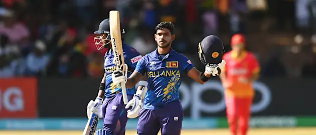 Pathum Nissanka of Sri Lanka celebrates scoring a century while leaving the field alongside teammate Kusal Mendis after winning the ICC Men's Cricket World Cup Qualifier Zimbabwe 2023 Super 6 match between Zimbabwe and Sri Lanka on July 02, 2023.