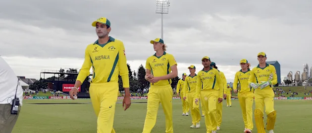 Jason Sangha and Australia's players leave the field