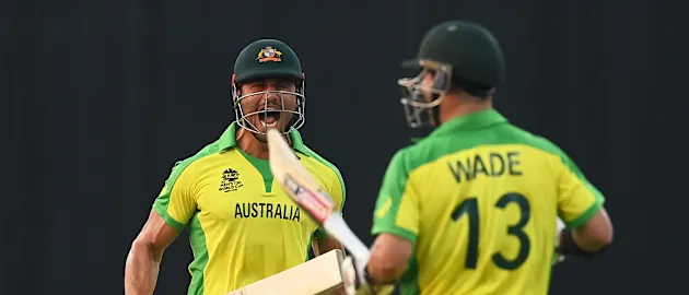 Marcus Stoinis and Matthew Wade of Australia celebrate following the ICC Men's T20 World Cup match between Australia and SA at Sheikh Zayed stadium on October 23, 2021 in Abu Dhabi, United Arab Emirates.