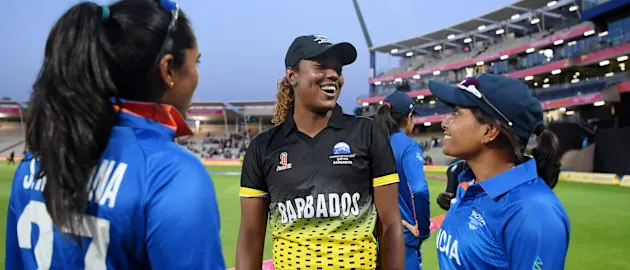 Hayley Matthews talks with India players after the match