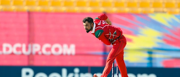 Bilal Khan bowling against Hong Kong.