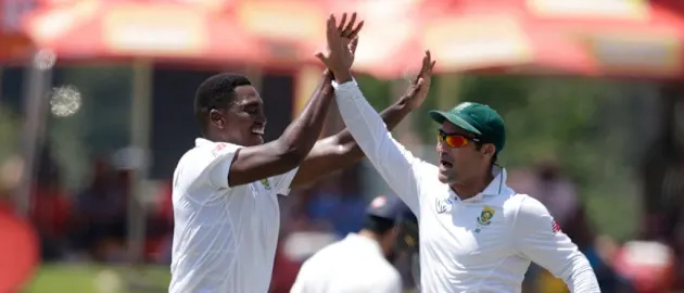 Lungi Ngidi and Dean Elgar celebrate the dismissal of Hardik Pandya