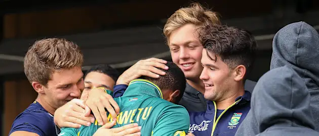 Wandile Makwetu of South Africa is congratulated by teammates after hitting 99 not out