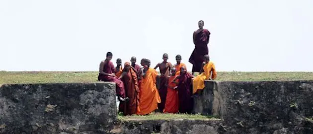 53483 Young Sri Lankan Buddhist monk watch the