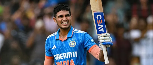 India's Shubman Gill celebrates after scoring a century (100 runs) during the second one-day international (ODI) cricket match between India and Australia