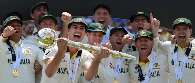 Pat Cummins of Australia lifts the ICC World Test Championship Mace on day five of the ICC World Test Championship Final between Australia and India