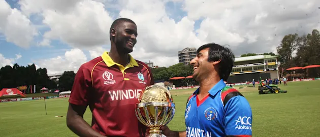 Jason Holder and Asghar Stanikzai with ICC Cricket World Cup Qualifier 2018 trophy