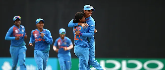 Radha Yadav of India celebrates a wicket with captain Harmanpreet Kaur during the ICC Women's World T20 2018 match between India and Australia at Guyana National Stadium on November 17, 2018 in Providence, Guyana.