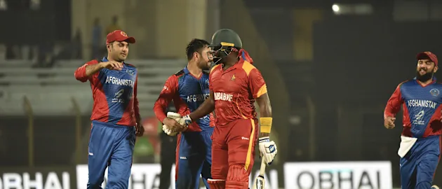 Rashid Khan and Mohammad Nabi congratulate Hamilton Masakadza on his international career