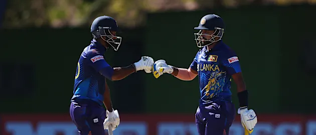 Dimuth Karunarathana and Sadeera Samarawickrama of Sri Lanka fist bump during the ICC Men's Cricket World Cup Qualifier Zimbabwe 2023 match between the Sri Lanka and Ireland