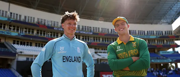 Tom Prest of England and George van Heerden of South Africa interact following the ICC U19 Men's Cricket World Cup match between England and South Africa at Sir Vivian Richards Stadium on January 26, 2022 in Antigua, Antigua and Barbuda.