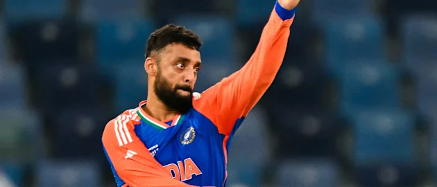 India's Varun Chakravarthy delivers a ball during the Asia Cup 2025 Super Four Twenty20 international cricket match