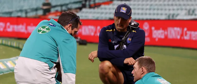 Medical staff attend to Steve Smith