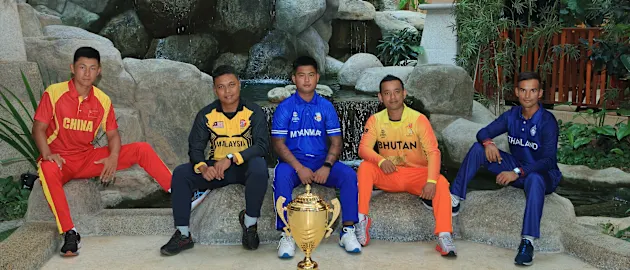 Captains pose with the trophy ahead of the ICC Men’s T20 World Cup Asia Qualifier B