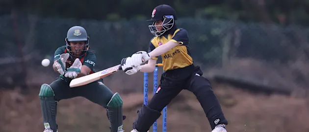 Mas Elysa Yasmin Zulkifi of Malaysia hits out against Bangladesh during CWG Qualifier 2022