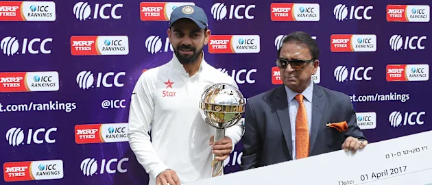 The Indian captain, Virat Kohli receives the mace and cheque  for one million dollars as his side finished No. 1 in the ICC Test rankings ahead of the April 1 cut-off date