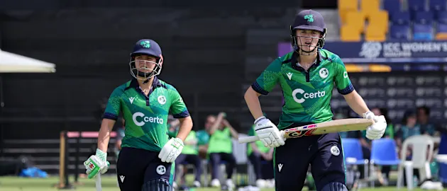  Amy Hunter and Gaby Lewis of Ireland make their way out to bat