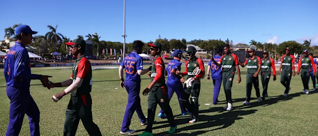 Players of Bangladesh and India interact following the ICC U19 Men's Cricket World Cup Super League Quarter Final 2 match between India and Bangladesh at Coolidge Cricket Ground.