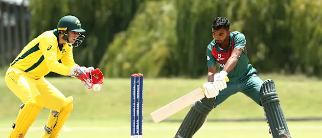 Tawhid Hridoy of Bangladesh bats with Patrick Rowe of Australia looking on during the ICC U19 Cricket World Cup warm up match between Bangladesh and Australia at Tuks Cricket Oval on January 13, 2020 in Pretoria, South Africa.