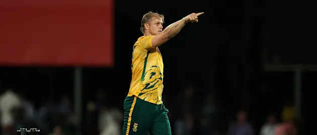 Corbin Bosch celebrates after taking the wicket of Adam Zampa