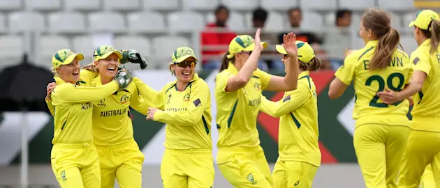 Australia celebrate the wicket of Smriti Mandhana of India during the 2022 ICC Women's Cricket World Cup match between India and Australia at Eden Park on March 19, 2022 in Auckland, New Zealand.