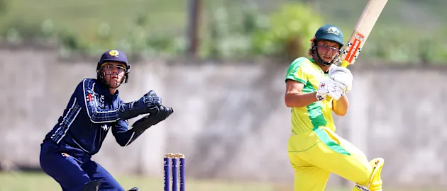 Campbell Kellaway of Australia plays a shot as Charlie Tear of Scotland keeps during the ICC U19 Men's Cricket World Cup match between Australia and Scotland at Conaree Sports Club on January 19, 2022 in Basseterre, Saint Kitts and Nevis.