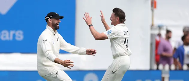 New Zealand's Nathan Smith (R) and teammate Daryl Mitchell celebrate on day one of the second Test cricket match between New Zealand and England 