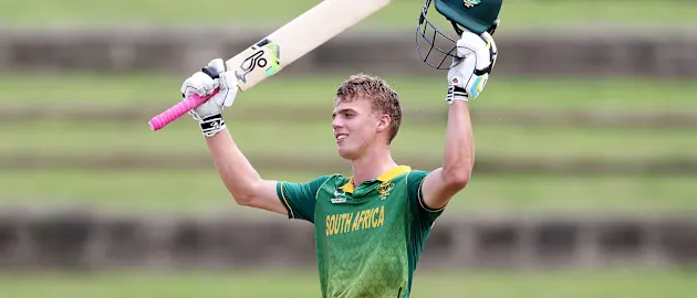 George Van Heerden of South Africa celebrates his century during the ICC U19 Men's Cricket World Cup match between South Africa and Ireland at Brian Lara Cricket Academy on January 21, 2022 in Tarouba, Trinidad And Tobago.
