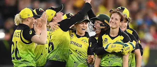 Megan Schutt of Australia is congratulated by team mates after getting a wicket during the ICC Women's T20 Cricket World Cup Final match between India and Australia at the Melbourne Cricket Ground on March 08, 2020 in Melbourne, Australia.