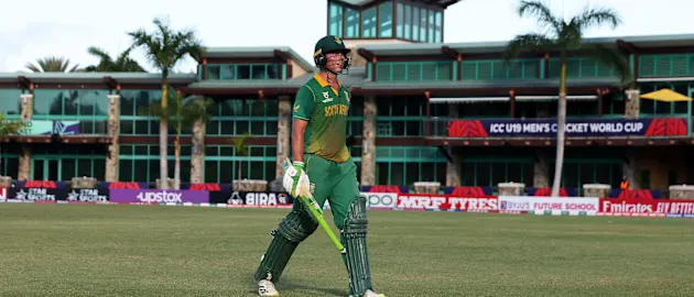 Dewald Brevis of South Africa makes his way off after being dismissed for 138 during the 7th/8th Playoff match between South Africa and Bangladesh at Coolidge Cricket Ground on February 03, 2022 in Antigua, Antigua and Barbuda.