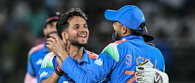 India's Harsh Dubey (L) celebrates with teammates after taking the wicket of Afghanistan's AM Ghazanfar during the first one-day international (ODI) cricket match between India and Afghanistan at the Himachal Pradesh Cricket Association Stadium.