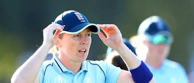 Heather Knight of England leads the team off the field at the end of the first inning during the 2022 ICC Women's Cricket World Cup Final match between Australia and England at Hagley Oval on April 03, 2022 in Christchurch, New Zealand.