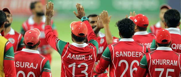 Team Oman celebrate Niko Davin wicket 2
