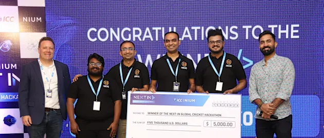 The winning team Fanisko with ICC's Finn Bradshaw and Dinesh Karthik