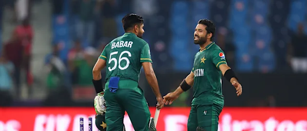 Mohammad Rizwan and Babar Azam of Pakistan celebrate after winning by 10 wickets following the ICC Men's T20 World Cup match between India and Pakistan at Dubai International Stadium on October 24, 2021 in Dubai, United Arab Emirates.