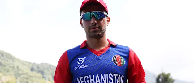 Suliman Safi of Afghanistan poses after being named Player of the Match following the ICC U19 Men's Cricket World Cup match between Afghanistan and Papua New Guinea at Diego Martin Sporting Complex on January 18, 2022 in Diego Martin, Trinidad And Tobago.