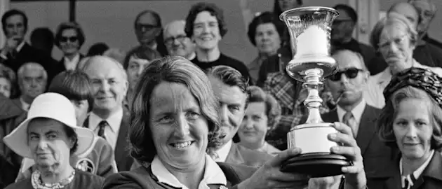 1973 – Rachael Heyhoe-Flint poses lifts the Jack Hayward Trophy as England win the first ODI World Cup.