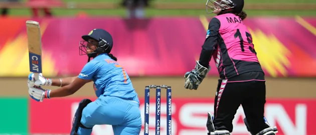 Harmanpreet Kaur of India sweeps as Katey Martin of New Zealand looks on during match 1 of the ICC Women's World T20 match between New Zealand v India on November 9, 2018 at the National Stadium in Providence, Guyana.