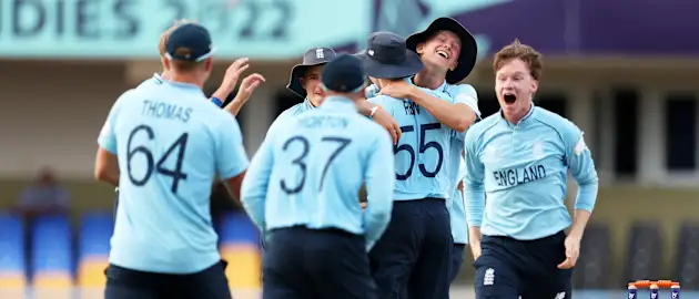 Players of England celebrate following the ICC U19 Men's Cricket World Cup Super League Semi Final 1 match between England and Afghanistan at Sir Vivian Richards Stadium on February 01, 2022 in Antigua.