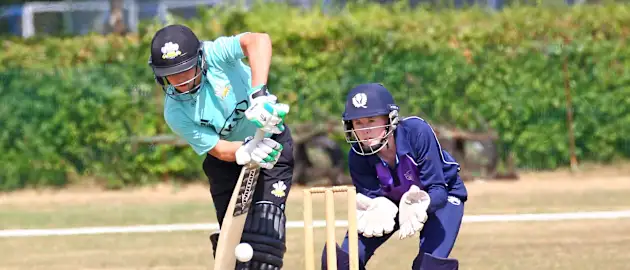 Sarah Bryce watches on as Marizanne Kapp hits to the leg-side