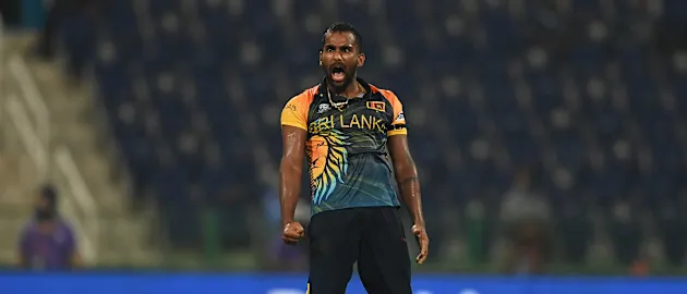 Chamika Karunaratne of Sri Lanka celebrates the wicket of David Wiese of Namibia during the ICC Men's T20 World Cup match between Sri Lanka and Namibia at Sheikh Zayed stadium on October 18, 2021 in Abu Dhabi, United Arab Emirates.